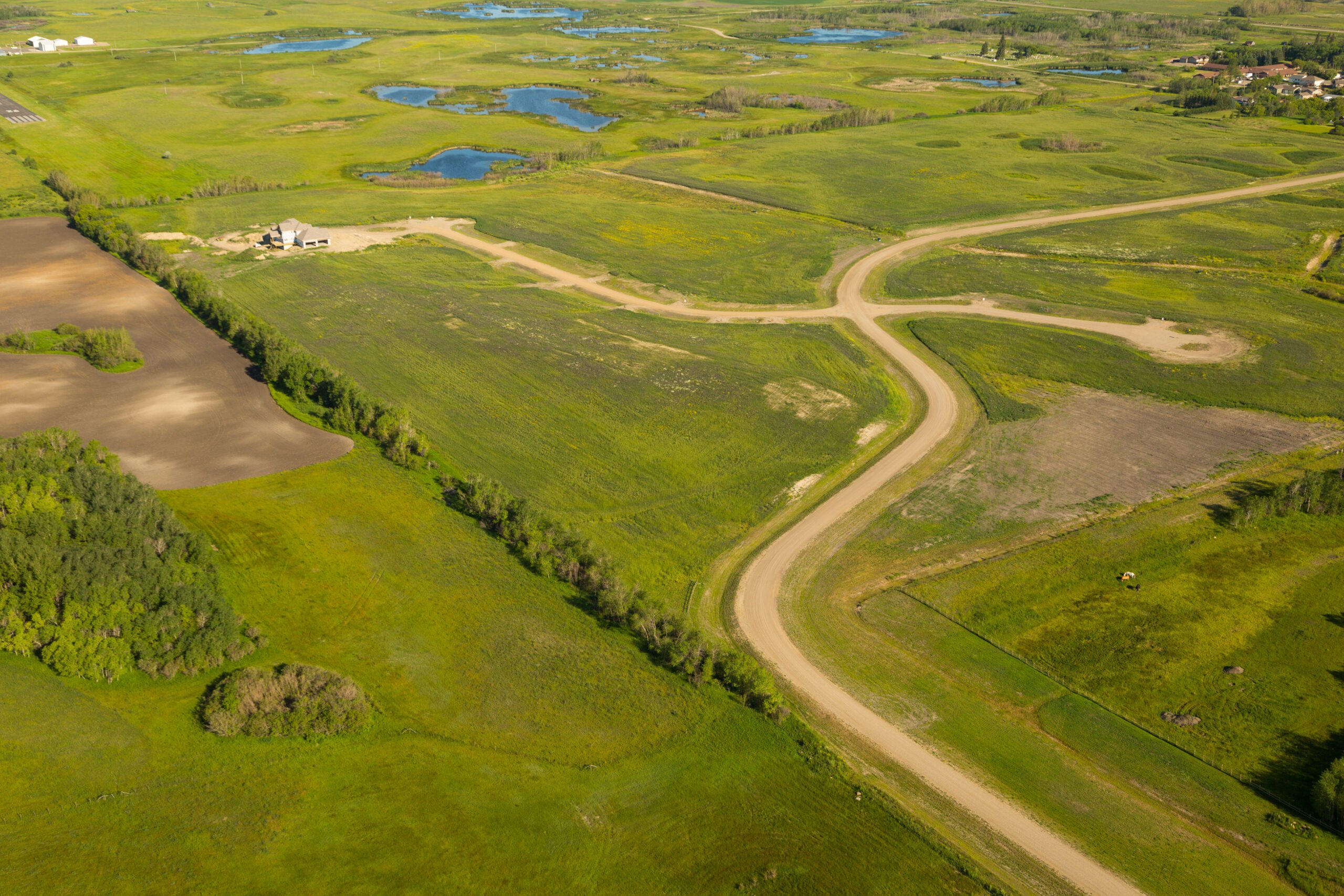 Aerial view of Brylee Estates roads winding through the prairie