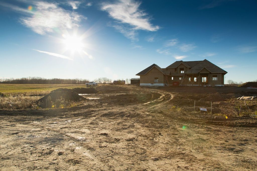 New home under construction on a Brylee Estates lot at sunrise