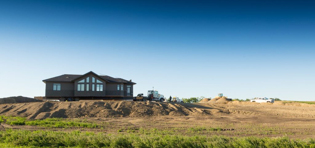 Two new homes on Brylee Estates lots with the prairie beyond